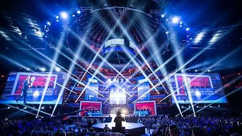 League of Legends World Championship finals stage packed with fans holding blue glowsticks
